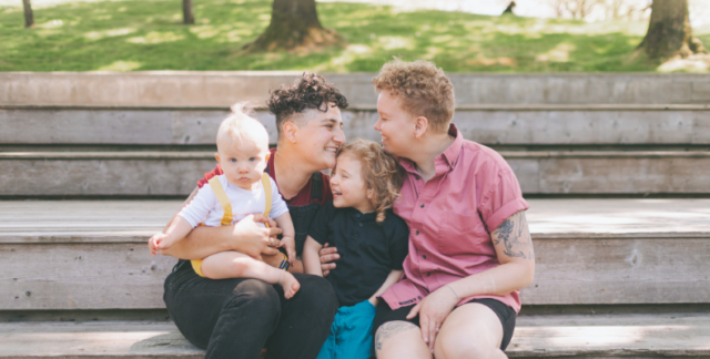 Same-sex couple with children.