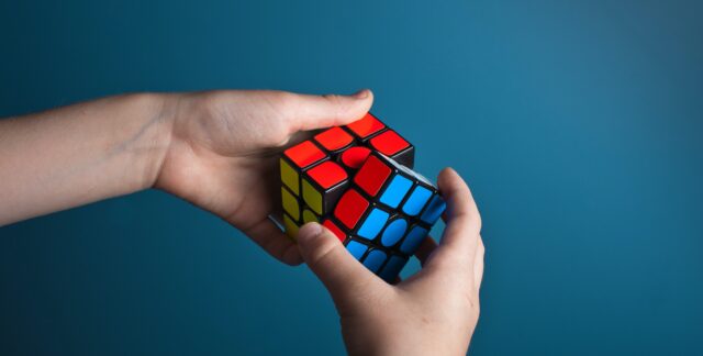 Solving a Rubik's cube puzzle.